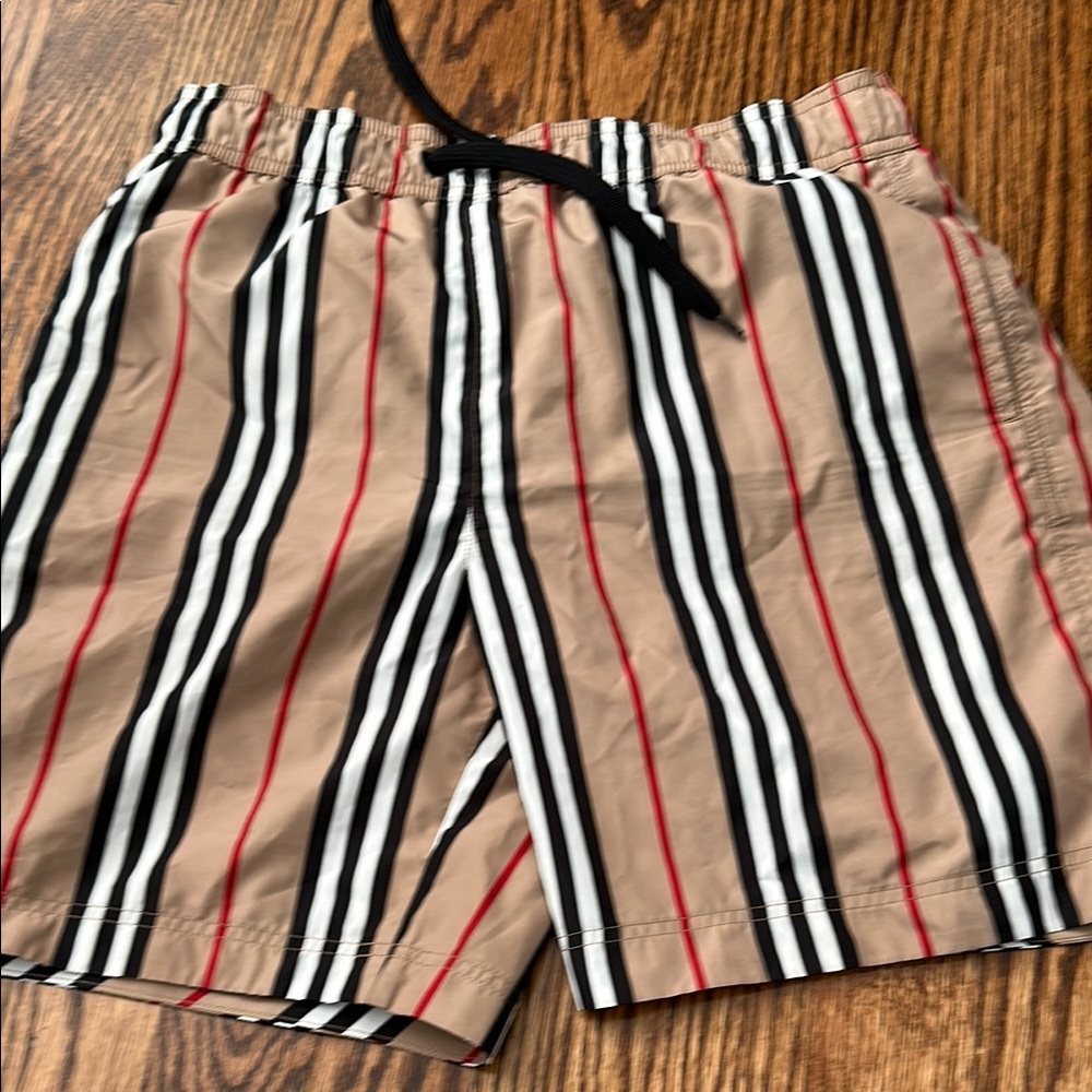 Burberry kids Striped Tan swim trunks with Black and Red Accents